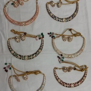 This image shows a collection of **Jadau Meenakari Hansli necklaces**, featuring intricate designs with colorful enamel work and possibly embedded stones.